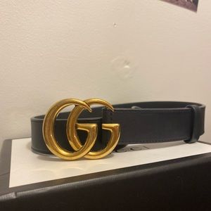 Gucci belt size 34 black with a gold logo